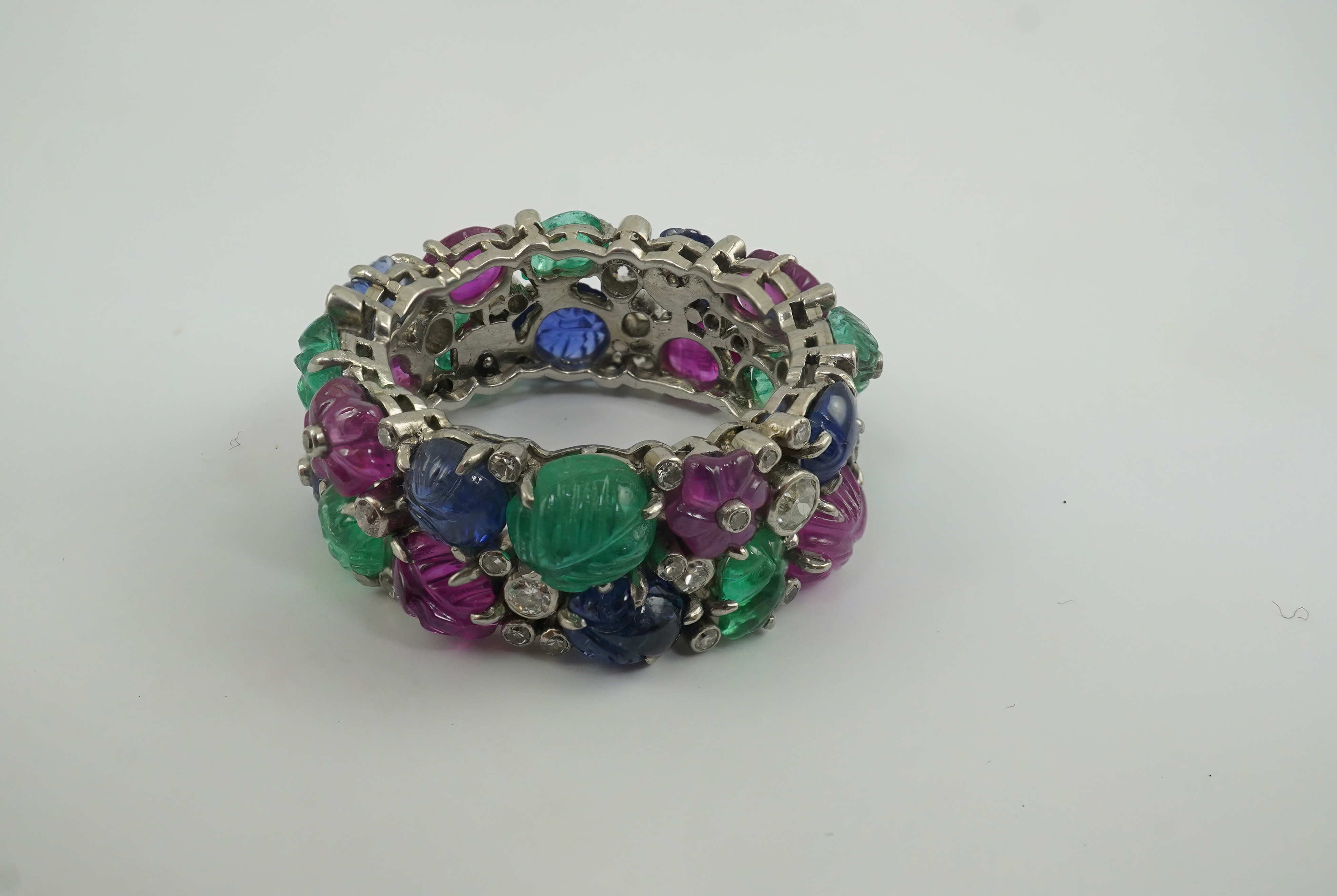 A Mauboussin style platinum, ruby, emerald, sapphire and diamond set 'Tutti Frutti' ring